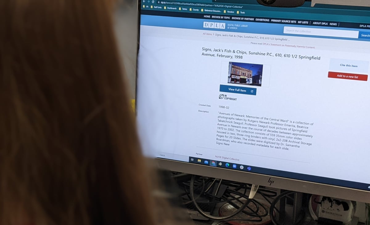 A person reviewing a digital item